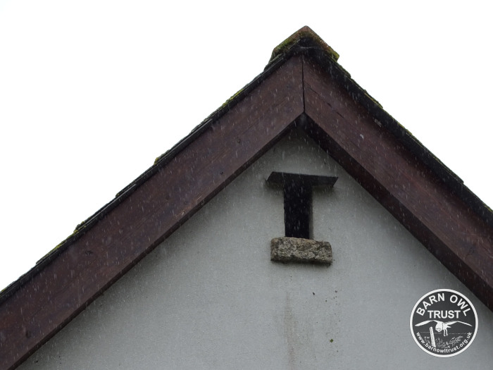 A small ventilation window under the eaves of a farm building